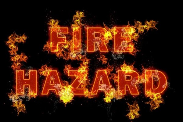 Fire hazard flaming text on black background